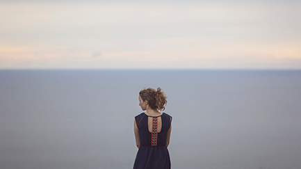 woman looking over water